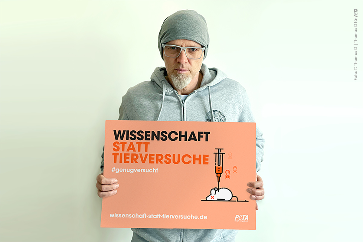 Motiv Thomas D mit Plakat Wissenschaft statt Tierversuche